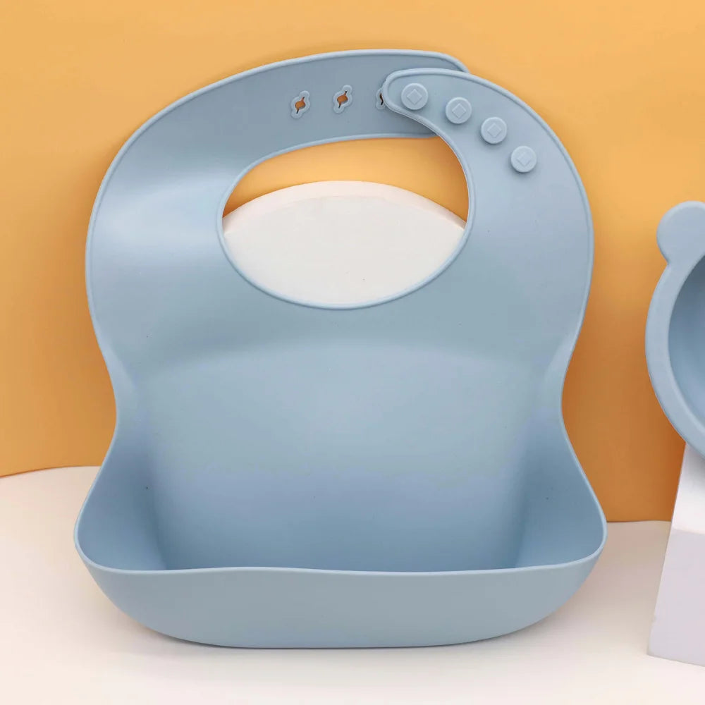 Babero de silicona para bebé con bolsillo